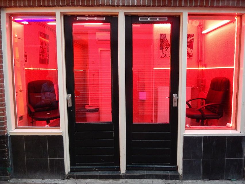 Amsterdam: Red Light District Exclusive Night Tour - The Condomerie and the sex work industry