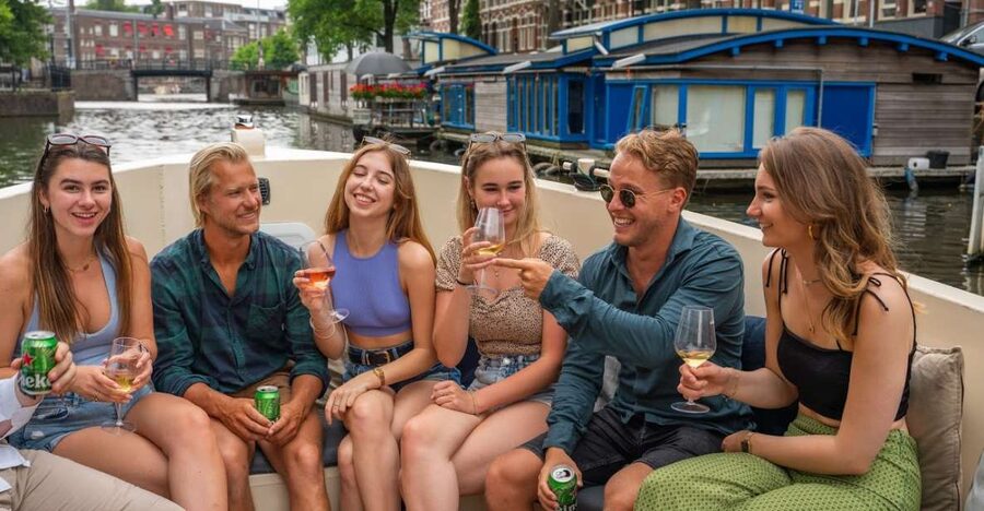 Amsterdam: Red-Light District Pub Crawl and Booze Boat Tour - A canal cruise with a party attached