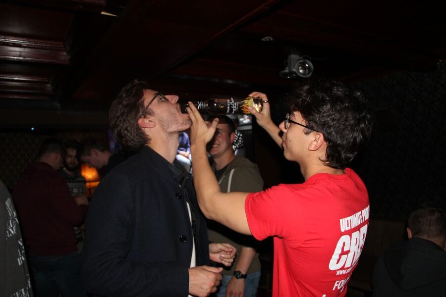 Amsterdam: Red-Light District Pub Crawl and Booze Boat Tour - Four bars, free shots, and drinking games