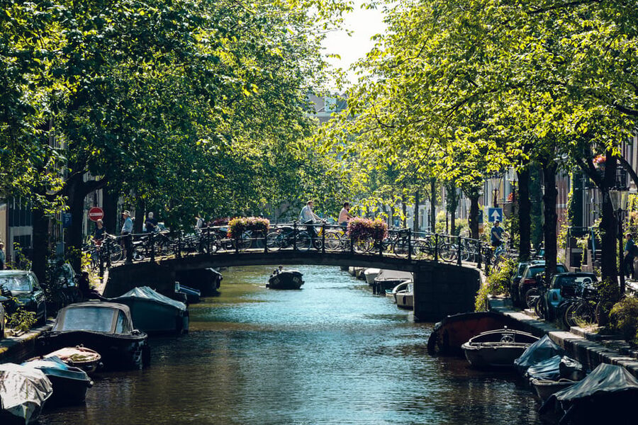 Amsterdam: Relaxed City Highlights Guided Bike Tour - Leidseplein brings a different side of the city
