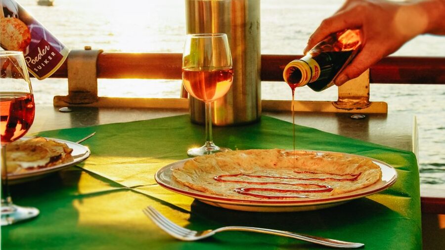 Amsterdam: River Cruise With All-You-Can-Eat Dutch Pancakes - Boarding, seating, and the first pancakes