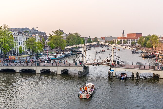 Amsterdam: Saloon Boat Cruise + Unlimited Drinks & Bite option - The rare view through several bridges