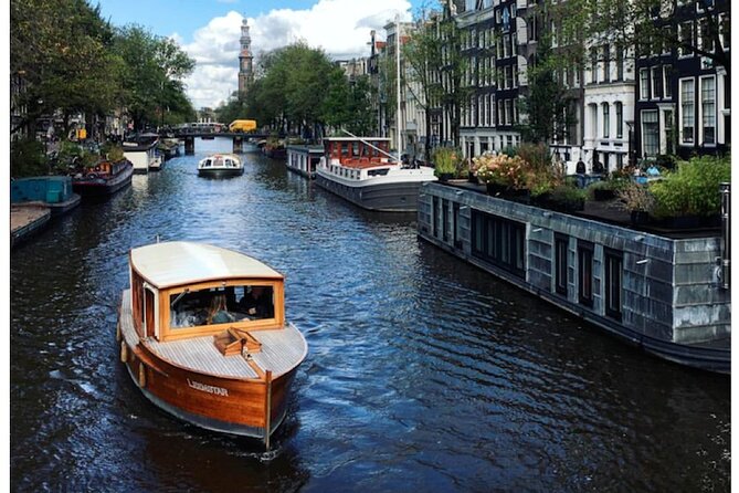 Amsterdam small-group canal cruise in 1920s saloon boat - Reguliersgracht and the Magere Brug