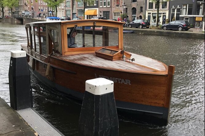 Amsterdam small-group canal cruise in 1920s saloon boat - Drinks, blankets, and the comfort factor