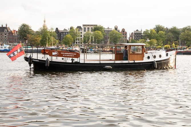 Amsterdam Small-Group Canal Cruise With Dutch Snacks and Drink - Through the UNESCO canal belt and Jordaan