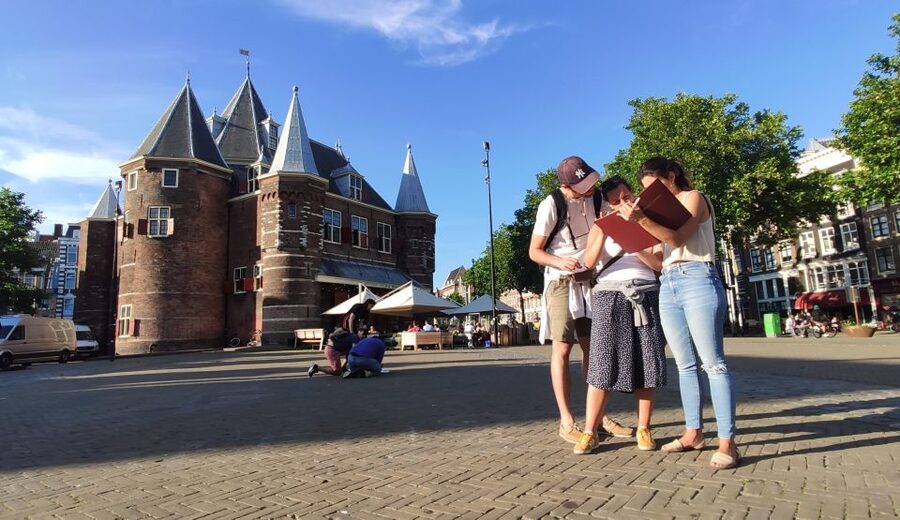 Amsterdam: Treasure Hunt Walking Tour "A Secret Sender" - Nieuwmarkt Square: your first proper clue