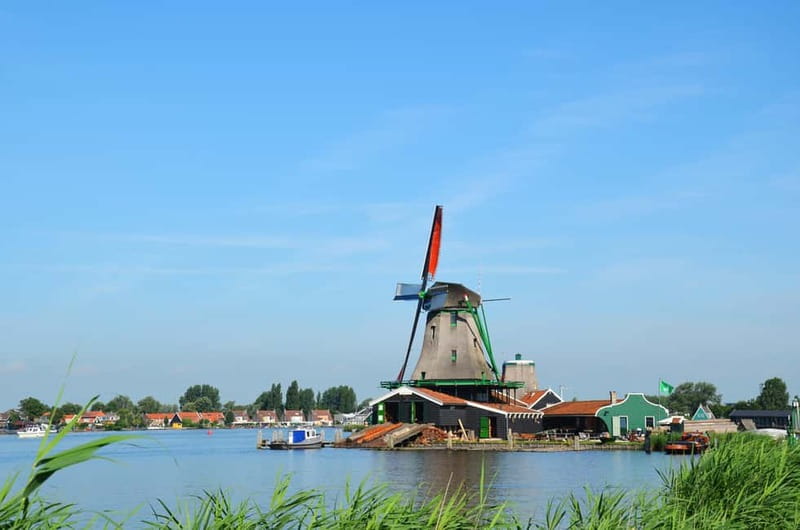 Amsterdam: Zaanse Schans windmills & Volendam Guided Tour - Leaving Amsterdam for North Holland