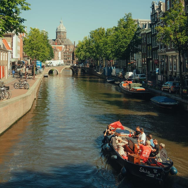 COZY AND FUN CANAL TOUR: A UNIQUE JOURNEY THROUGH AMSTERDAM - Rain, Cold Weather, and the Covered Boat Option