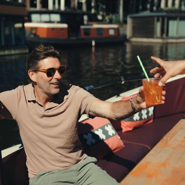 COZY AND FUN CANAL TOUR: A UNIQUE JOURNEY THROUGH AMSTERDAM - Grimburgwal and the Return Through Oudezijds Voorburgwal