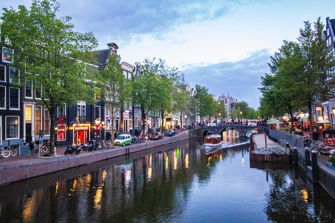 Discover the LGBT side of Amsterdam with a Local - Meeting near the water at Prins Hendrikkade