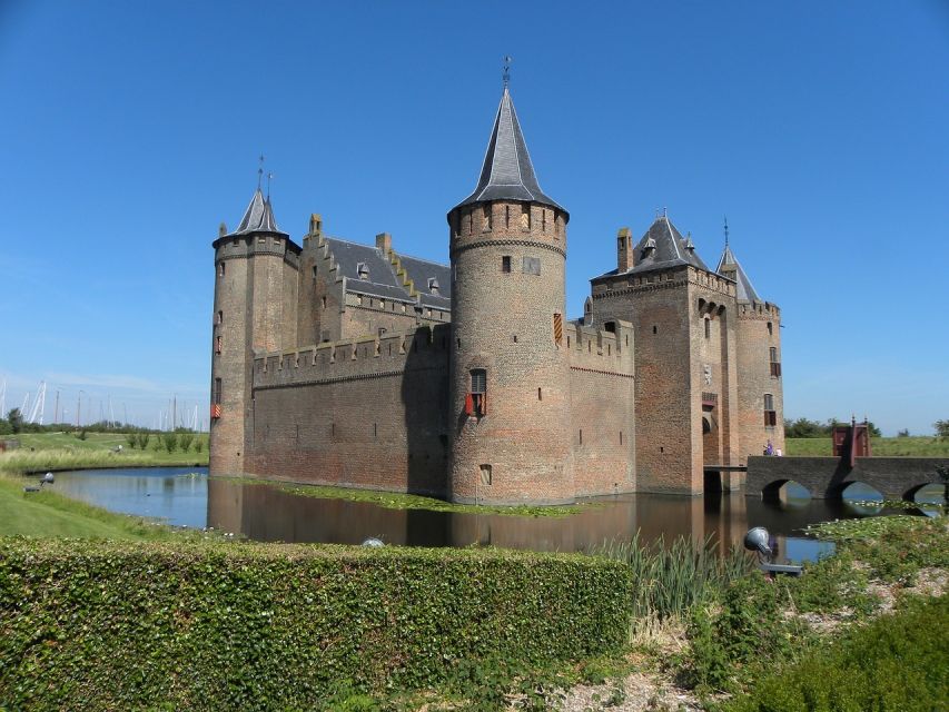 From Amsterdam: Private Day Trip to the Dutch Castles - Entering Muiden Castle across the drawbridge