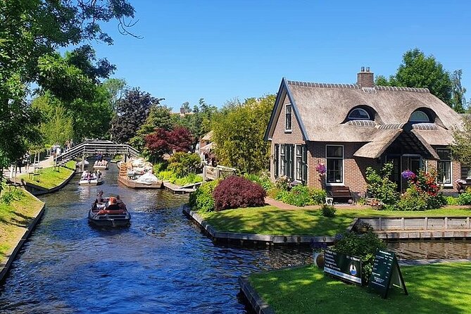 Giethoorn Day Tour from Amsterdam with Small Boat Ride - Walking into a village built around canals