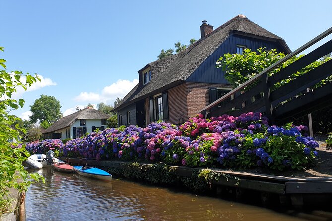 Giethoorn, Zaandam & Zaanse Schans Day Tour w/ Small Boat Ride - Zaanse Schans: windmills, green houses, and busy paths