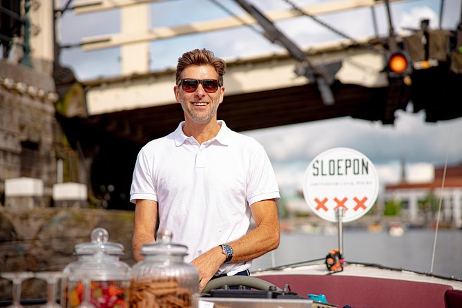 Guided Amsterdam Canal Cruise – Snacks & Drinks on board(1 Hour) - Magere Brug and Amsterdam’s Leaning Houses