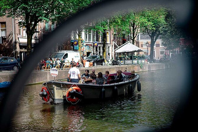 Guided Amsterdam Canal Cruise – Snacks & Drinks on board(1 Hour) - Medieval Walls and Less Accessible Canals