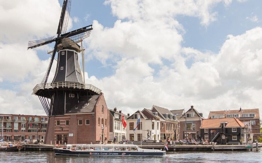 Haarlem: Dutch Windmill & Spaarne River Sightseeing Cruise - Covered boats make Dutch weather less of a gamble