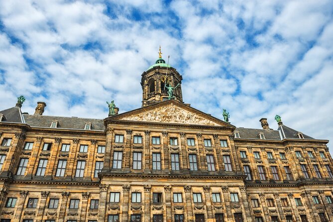 Historic Amsterdam Walking Tour: Royal Palace & Flea Markets - Shopping for curiosities at Waterlooplein Market