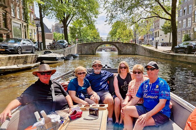 Private 90 Minute Amsterdam Canal Belt Exploration Cruise - Starting on the Amstel with Amsterdam’s leaning houses