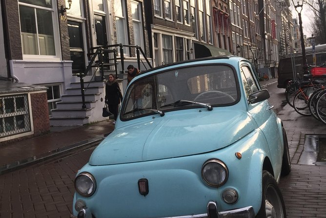 Private Amsterdam Bike Tour with a local guide (also for families) - Riding under the Rijksmuseum