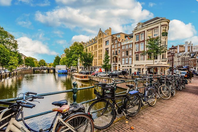 Private Tour: Amsterdam City Walking Tour and Canal Cruise - Dam Square and the city center