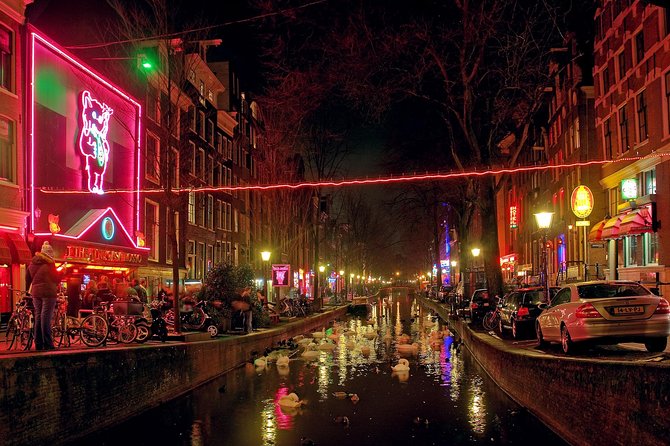 Red Light District tour with canal cruise - Dam Square and the city built on wooden poles