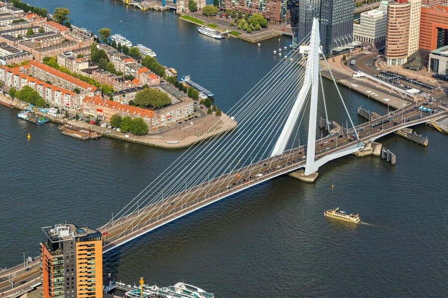 Rotterdam and Kinderdijk Daily Walking and Boat Tour - Rotterdam begins at a railway station built like a gateway