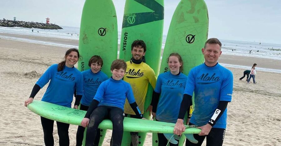 Scheveningen Beach: 1,5 hour Surf experience for families - Getting your first board into the Dutch waves