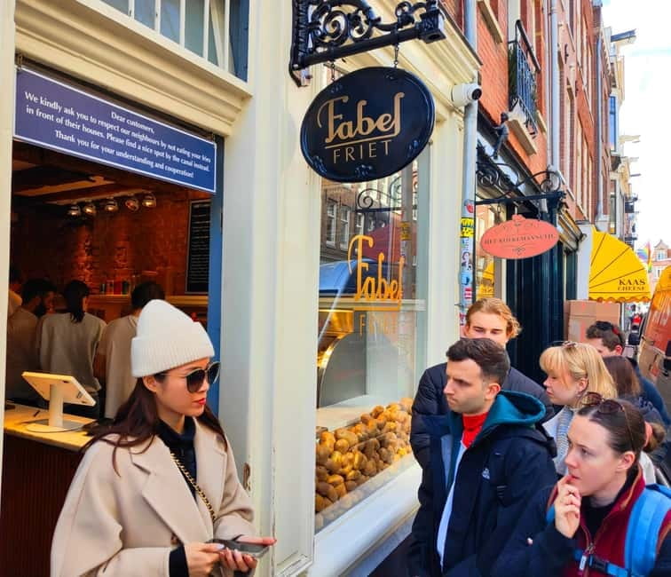 Skipping Lines & Sipping Beers: A History Tour of Amsterdam - Walking through canals and less obvious streets
