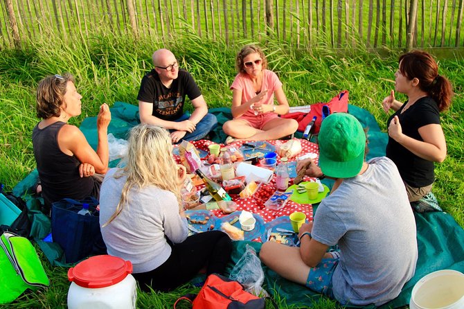 Small-Group Guided Sunset Canoe Tour in Waterland with Dinner - Paddling through reeds, meadows, and village waterways