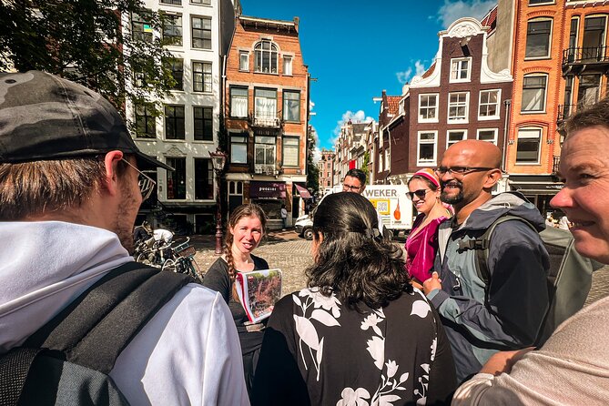 Small Group Walking Tour - Hello Amsterdam - Damrak mixes canal views with a true-or-false game
