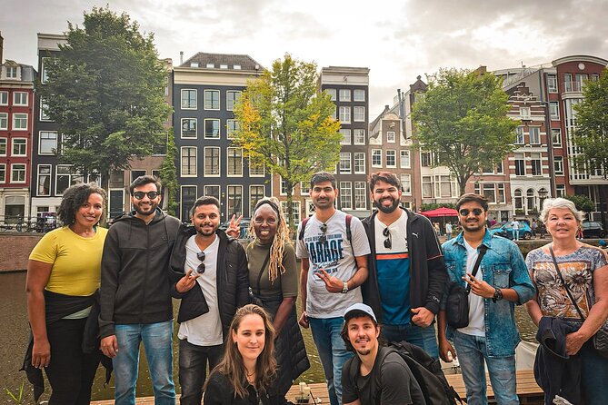 Small Group Walking Tour - Hello Amsterdam - Dam Square sets the city’s scale