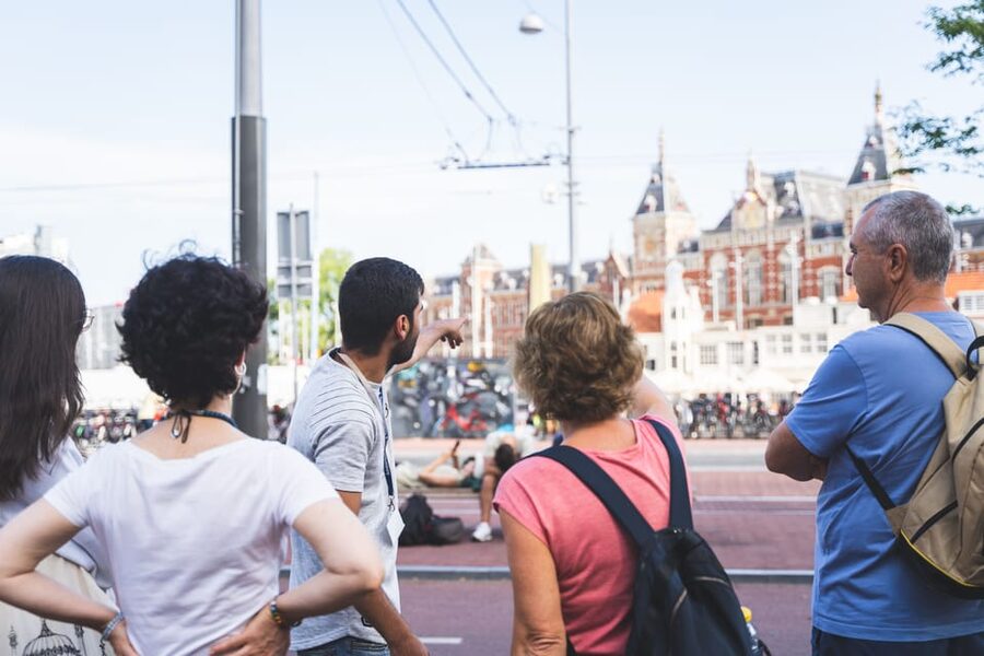 Small-Group Walking Tour with Amsterdam Canal Cruise - Beursplein, Dam Square, and the royal center